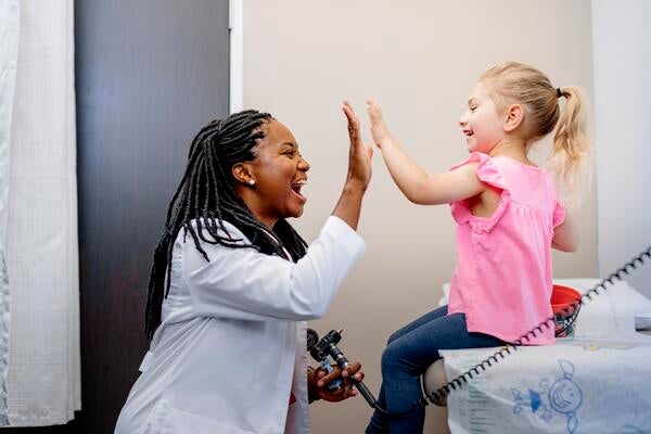 Dr. Osei with patient