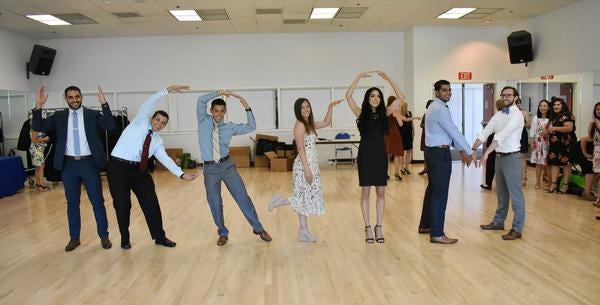 Students spelling out UCR SOMq